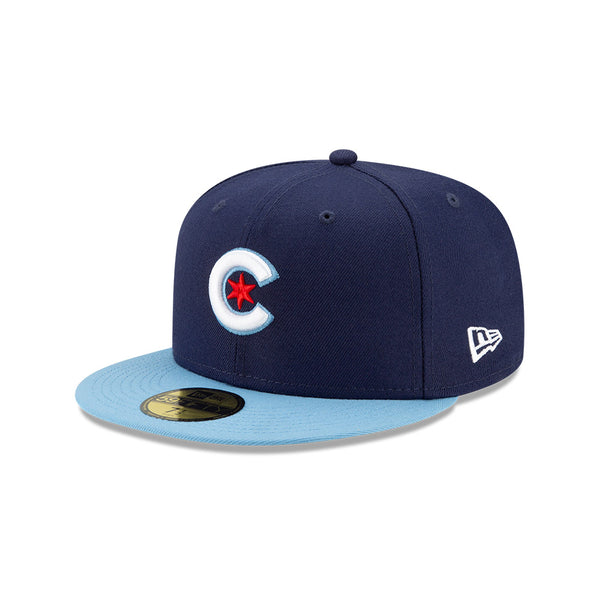 Cubs fan balances hat brim on head